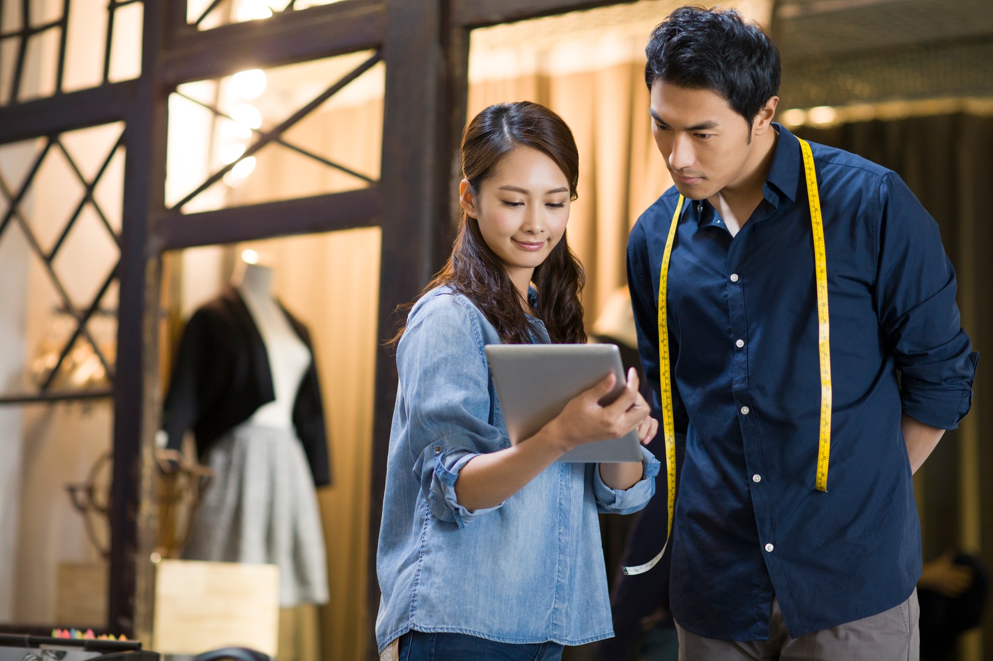 Fashion designers using digital tablet